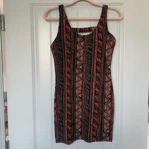 Orange/brown/black fitted mini dress. Size M.